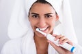 Beautiful Woman In Bathrobe Brushing Teeth Royalty Free Stock Photo