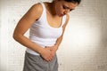 Close up of beautiful woman body suffering from stomachache, period pain and menstrual cramps Royalty Free Stock Photo