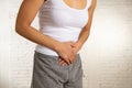 Close up of beautiful woman body suffering from stomachache, period pain and menstrual cramps Royalty Free Stock Photo