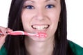 Close up of a beautiful woman brushing her teeth Royalty Free Stock Photo