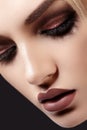 Close-up of Beautiful Woman Face. Fashion Evening Make-up, Glitter Eyeshadows, Matt Lips, Shiny Clean Skin. Sexy Style