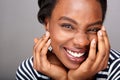 Close up beautiful woman laughing with hands by face Royalty Free Stock Photo