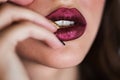 Close up of beautiful woman lips with lipstick. Open mouth. Cosmetology, fashion makeup concept. Beauty studio shot. Royalty Free Stock Photo