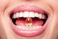 Close Up Of Beautiful Woman Opened Mouth Holding Fish Oil Pill In White Teeth. Smiling Girl Holding Capsule With Omega-3 Between