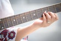 Close up beautiful woman playing acoustic guitar.woman`s hands playing acoustic guitar Royalty Free Stock Photo