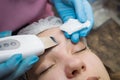 Close-up Of Beautiful Woman Receiving Ultrasound Cavitation Facial Peeling. Ultrasonic Skin Cleansing Procedure. Beauty Treatment Royalty Free Stock Photo