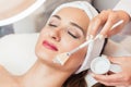Close-up of a beautiful woman relaxing during facial treatment i Royalty Free Stock Photo