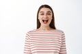 Close up of beautiful woman singing, standing with opened mouth and silly smile, shouting, calling for someone, standing Royalty Free Stock Photo