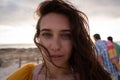 Close-up of a beautiful woman standing at beach on a sunny day Royalty Free Stock Photo