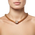 Close-up of beautiful woman wearing shiny diamond necklace