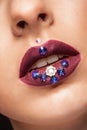 Close up of beautiful womna with mate creative lipstick and diamond flowers