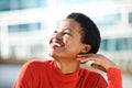 Close up beautiful young african american woman smiling and looking away Royalty Free Stock Photo