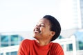 Close up beautiful young african woman smiling and looking away Royalty Free Stock Photo