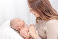 Close up beautiful young asian mother holding her newborn one month baby sleep on her lap. Healthcare and medical.  Lovely asia Royalty Free Stock Photo