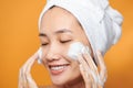 Close up of beautiful young Asian woman with cleansing foam for skin care Royalty Free Stock Photo