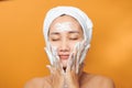 Close up of beautiful young Asian woman with cleansing foam for skin care Royalty Free Stock Photo