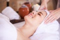 Close up beautiful young asian woman lying relaxing in the spa salon massage Royalty Free Stock Photo