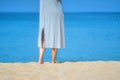 Close up beautiful young female feet barefoot walking on sand beach with sea and sky background. Morning outdoors exercise in a su Royalty Free Stock Photo