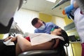 Close up of beautiful young female having dental check up in dental clinic. Royalty Free Stock Photo