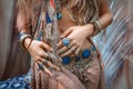 Close up of beautiful young gypsy style woman with lots of accessories