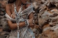 Close up of beautiful young woman with boho jewelry