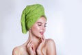 Close-up of beautiful young woman with green bath towel Royalty Free Stock Photo