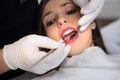 Close up of beautiful young woman having dental check up in dental office Royalty Free Stock Photo