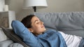Close up beautiful young woman relaxing on couch Royalty Free Stock Photo