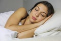 Close up of beautiful young woman smiling while sleeping in her Royalty Free Stock Photo