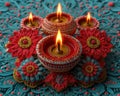 A close-up of beautifully crafted diya lamps glowing atop a vibrant, intricate rangoli design.