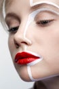 Close-up beauty fashion shot of female face. Woman with an unusual creative makeup