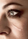 Close up of beauty girl cry. Woman with tear on face