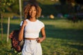 Close up beauty outdoor portrait of attractive charming young african-american smiling woman with natural make up and afro hair, Royalty Free Stock Photo