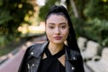 Close up beauty outdoor portrait of attractive charming young Asian brunette smiling woman with natural make up and Royalty Free Stock Photo