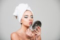 Close-up beauty portrait of attrctive cute sensual young woman, perfect skin, fashion makeup. Woman with towel on head Royalty Free Stock Photo