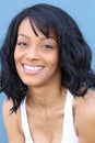 Close up beauty portrait of a young and attractive African American black woman with perfect skin, softly smiling. Royalty Free Stock Photo