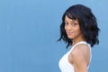 Close up beauty portrait of a young and attractive African American black woman with perfect skin, with toothless smile