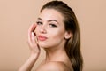 Close up beauty portrait of young attractive Caucasian blond lady with natural nude make up, posing to camera on studio Royalty Free Stock Photo