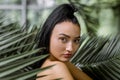 Close up beauty portrait of young charming Chinese Asian woman with ponytail hair style, posing to camera while standing Royalty Free Stock Photo