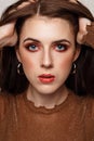 Close-up beauty portrait of young woman with beautiful bright makeup. Modern smokey eyes with colorful eyeshadows. Model with soft Royalty Free Stock Photo