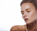 Close up beauty portrait of young woman with beautiful bright makeup. Modern smokey eyes with yellow eyeshadows. Royalty Free Stock Photo