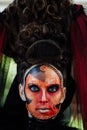 Close-up beauty red art make-up portrait of halloween woman Witch baroque. Royalty Free Stock Photo