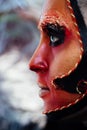 Close-up beauty red art make-up portrait of halloween woman Witch baroque. Royalty Free Stock Photo