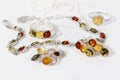 Close-up beauty silver pendant, earrings, rings and bracelet with different colors baltic amber Royalty Free Stock Photo