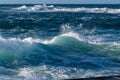 A beautiful striped turquoise wave off the coast at Sennen, Cornwall