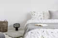 Close-up of a bed with eco cotton and wool bedding and pillows in a bright bedroom interior. Real photo. Royalty Free Stock Photo