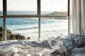 Close up bedroom with white messy bedding and big window with view to beautiful sea ocean beach. Summer, travel Royalty Free Stock Photo