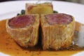Close up of Beef Wellington with Spinach and fried potatoes