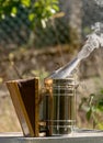 Close-up of a beekeeping smoker smoking in an apiary