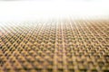 Close-up of beige fabric plastic lattice, grid texture pattern